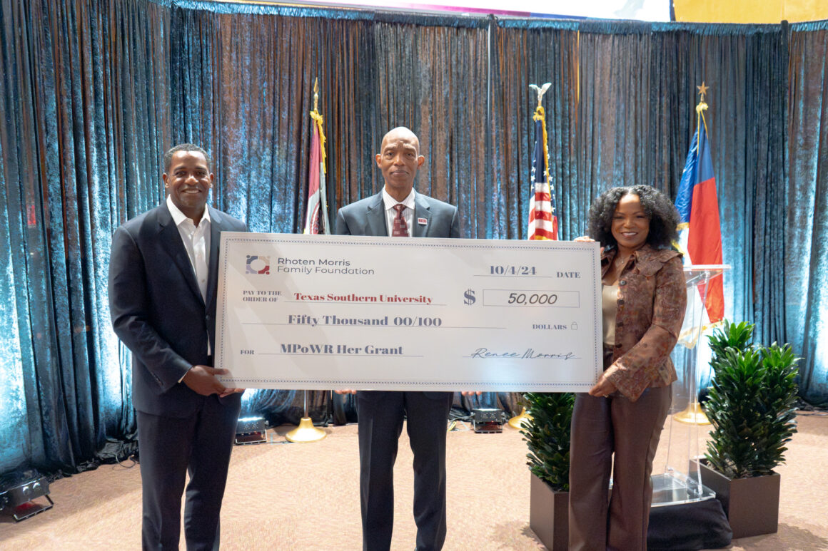 Chief Curl Officer Renee Rhoten Morris and husband Dr. Milton Morris present $50,000 check to TSU President James W. Crawford III.