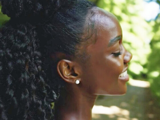 Curly-haired woman enjoying outdoor fun