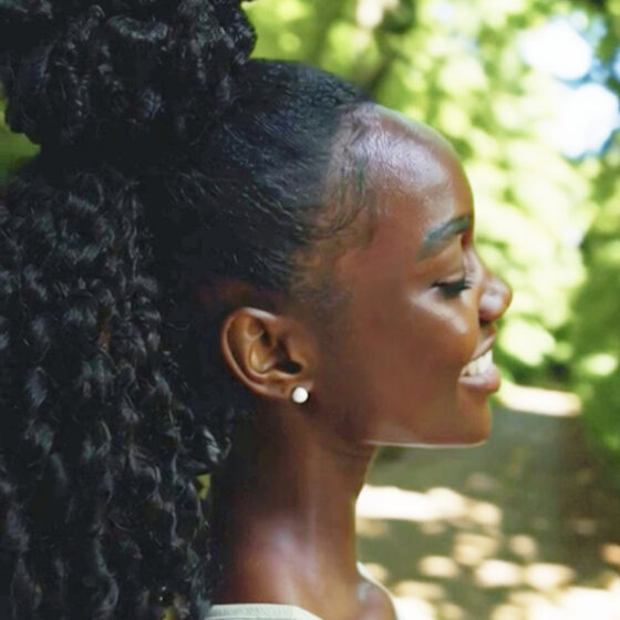 Curly-haired woman enjoying outdoor fun