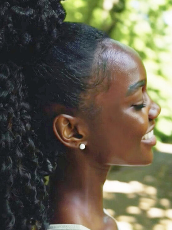 Curly-haired woman enjoying outdoor fun