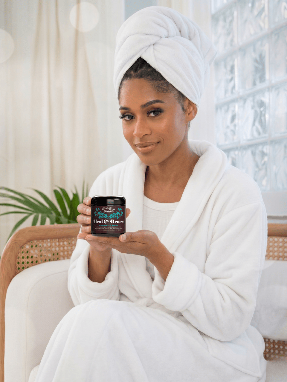 Model using Heal & Renew for her hair care as self care